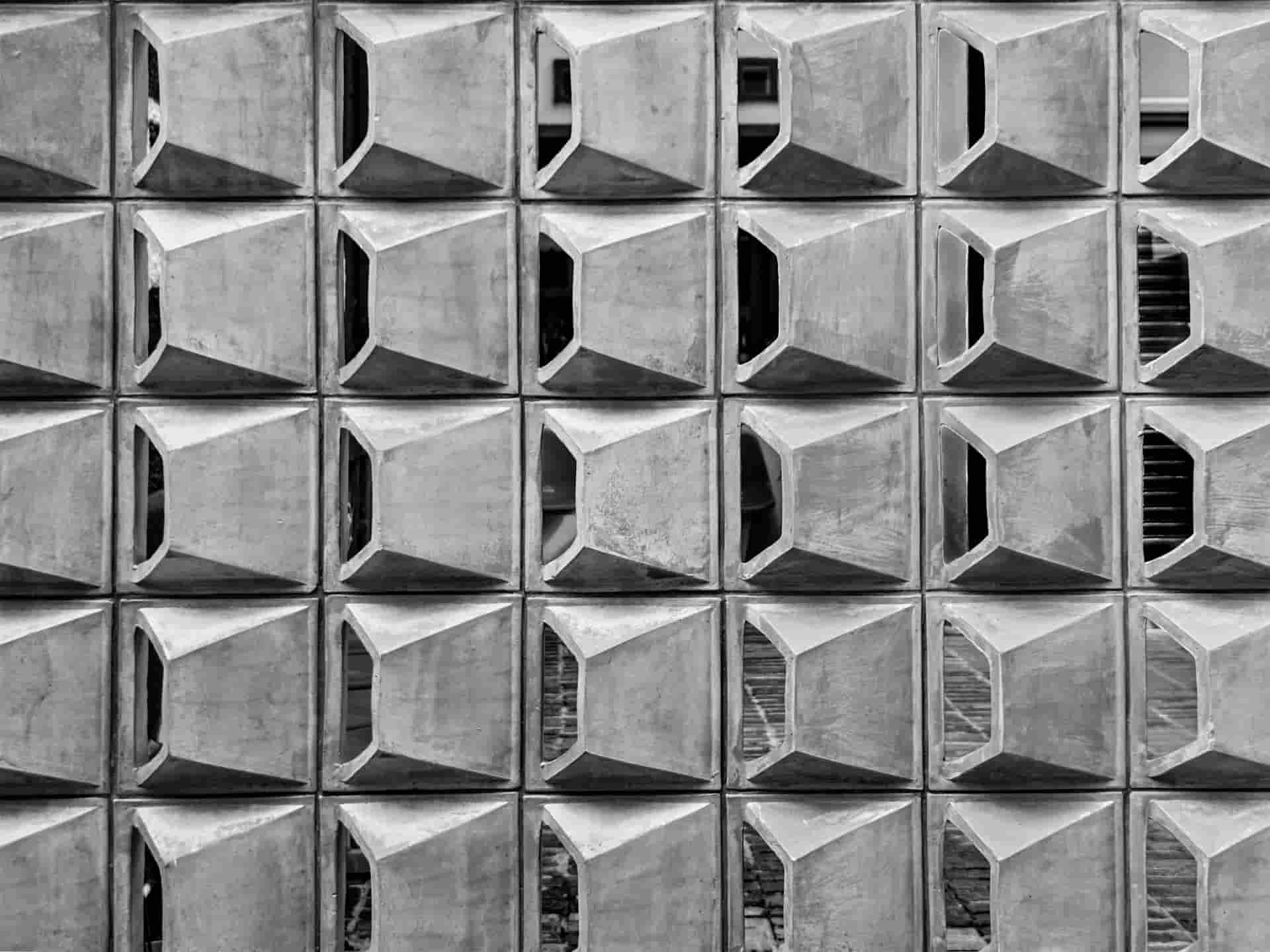 a black and white photo of a building made of concrete blocks